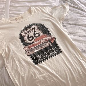 I am selling a size small t-shirt from alter’d state. It is beige, pink, black